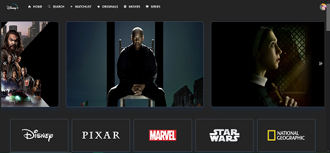 The top of the Disney+ clone is shown. A slider component with big film posters goes along the top of the screen, all of which grow slightly on hover and provide a small blurb for each film.